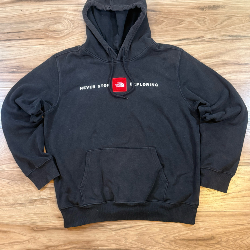 The North Face Black Hoodie with Red Logo Patch